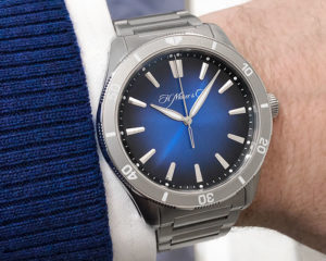 The Pioneer Center Seconds with blue sunburst dial features a rotating bezel and a sporty steel bracelet