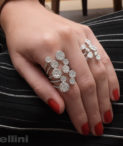 Five Row Open Round Diamond Rings on woman's hand