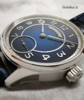 Laine_G2 flat Closeup Drk Blue Dial Strap Silver hands Arabic numbers
