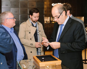 Leon Adams examines a Greubel Forsey timepiece during the Meet the Watchmakers event