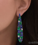 Sapphire and Emerald Long Drop Earrings on ear