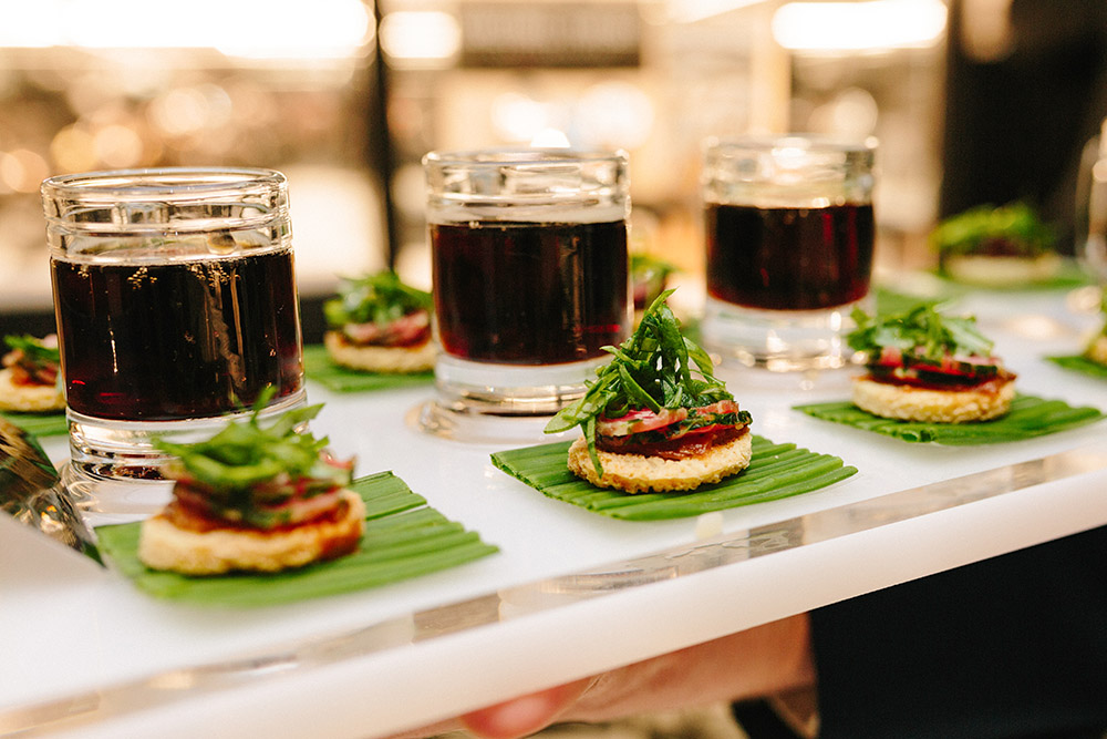 Carpaccio of beef on parmesan crisps with mini mugs of Guinness + mini root beer, by Peter Callahan Catering