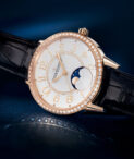 Rendez Vous Moon 34mm lying on side on blue surface