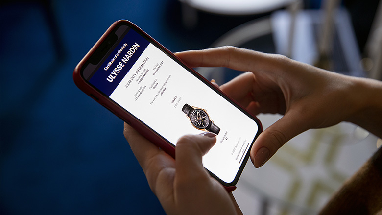 Ulysse Nardin Block Chain Warranty on smartphone screen