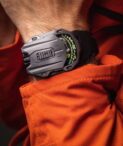 UR-105 TTH Tantalum on wrist Orange jacket